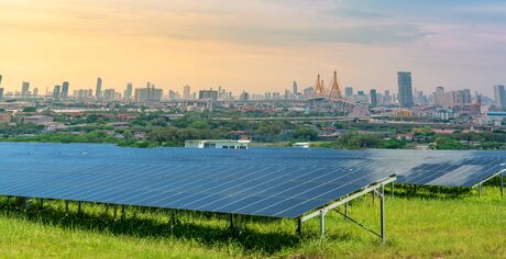 Sustainable city with green energy and net zero emissions. Solar power. Renewable resources. Eco-friendly urban planning and environmental conservation. Carbon neutrality. Eco-conscious infrastructure