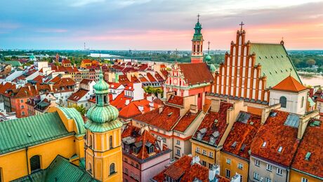 aerial view over the castle square in warsaw overlooking the old town in spring at dawn