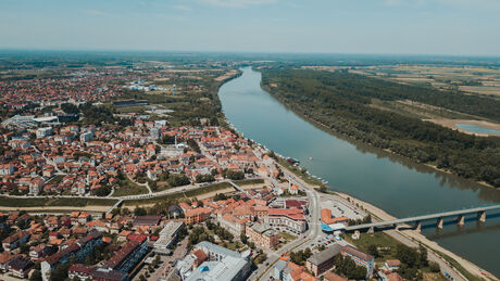 An aerial view of the river and the Brcko district with a bridge connecting the lands, Bosnia and Herzegovina