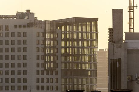 Kyiv, Ukraine. Contemporary architectural complex with glass office buildings and residential towers near Velyka Vasylkivska. Urban landscape of a modern business district in morning light